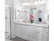 Modern bathroom with double vanity and granite countertop at 11583 Chatham Dr, Hampton, GA 30228