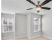 Bright bedroom with ceiling fan and two windows at 134 Briargate Dr # 16, Johns Creek, GA 30097