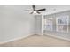 Spacious bedroom with ceiling fan and two windows at 134 Briargate Dr # 16, Johns Creek, GA 30097