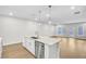 Modern kitchen island with white cabinets and stainless steel dishwasher at 134 Briargate Dr, Johns Creek, GA 30097