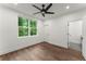 Bright bedroom featuring hardwood floors and a ceiling fan at 1779 Beckham Ne Pl # 58, Atlanta, GA 30324