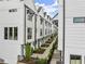 Modern townhomes with landscaped walkway at 1779 Beckham Ne Pl # 58, Atlanta, GA 30324