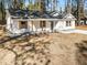 Newly built home featuring white siding, gray roof, and landscaping at 2716 Battle Sw Trl, Marietta, GA 30064