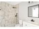 Modern bathroom with marble shower, vanity, and black matte fixtures at 2716 Battle Sw Trl, Marietta, GA 30064