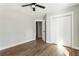 Bedroom boasts wood-look floors, a closet, neutral walls, and a ceiling fan at 2716 Battle Sw Trl, Marietta, GA 30064