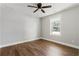 Sunny bedroom with wood floors, window, and ceiling fan at 2716 Battle Sw Trl, Marietta, GA 30064