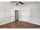 Bedroom with wood floors, ceiling fan and double door closet at 2716 Battle Sw Trl, Marietta, GA 30064