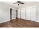 Bedroom boasts hardwood floors, a ceiling fan, and multiple closets for storage at 2716 Battle Sw Trl, Marietta, GA 30064