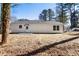 Rear view of the exterior features a new patio and ample yard space at 2716 Battle Sw Trl, Marietta, GA 30064