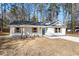 Newly built home with white siding, gray roof, and wood accents at 2716 Battle Sw Trl, Marietta, GA 30064