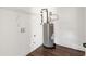 Laundry room with water heater and shelving at 2716 Battle Sw Trl, Marietta, GA 30064