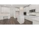 Modern kitchen featuring white cabinets and an island at 13561 Whitman Ln, Covington, GA 30014