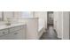 Bathroom featuring a bathtub, tile floors, and a vanity with white cabinets at 13561 Whitman Ln, Covington, GA 30014