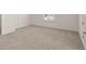 Bedroom showcasing neutral carpet and a bright window for ample natural light at 13561 Whitman Ln, Covington, GA 30014