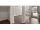 Living room area with hardwood floors, white trim, and a view of the front porch at 13561 Whitman Ln, Covington, GA 30014