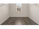 Large walk-in closet with hardwood floors and shelving ready to organize your wardrobe at 13561 Whitman Ln, Covington, GA 30014