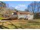 House exterior with covered porch and large yard at 3123 Shiloh Pl, Canton, GA 30115