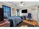 Spacious bedroom with TV and hardwood floors at 4497 Black Water Cv, Ellenwood, GA 30294