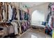 Walk-in closet with ample shelving and hanging space at 4497 Black Water Cv, Ellenwood, GA 30294