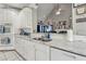 Kitchen with white cabinets and marble countertops at 4497 Black Water Cv, Ellenwood, GA 30294