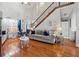 Living room with hardwood floors and comfy seating at 4497 Black Water Cv, Ellenwood, GA 30294