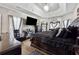 Large main bedroom with a king-size bed and plenty of closet space at 4497 Black Water Cv, Ellenwood, GA 30294
