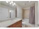 Bathroom boasts granite countertop, bathtub and shower at 860 Peachtree Ne St # 1412, Atlanta, GA 30308