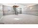 Spacious finished basement featuring a spiral staircase at 262 French Village Blvd, Sharpsburg, GA 30277