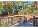 A backyard deck with steps leading down to a fenced yard at 1679 Hollyhock Ter, Decatur, GA 30032