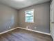 Gray walls and wood-look flooring in this bedroom at 1679 Hollyhock Ter, Decatur, GA 30032