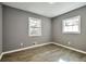 Simple bedroom with gray walls and wood-look flooring at 1679 Hollyhock Ter, Decatur, GA 30032