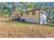 View of the house exterior, showcasing the back of the house and a deck at 1679 Hollyhock Ter, Decatur, GA 30032