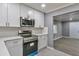 Modern kitchen with stainless steel appliances and white cabinets at 1679 Hollyhock Ter, Decatur, GA 30032