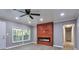 Bright living room with wood-look floors and ceiling fan at 1679 Hollyhock Ter, Decatur, GA 30032