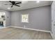 Spacious living room with gray walls and wood floors at 1679 Hollyhock Ter, Decatur, GA 30032