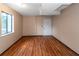 Spacious basement room with wood flooring and an exterior door at 2491 Crumps Landing Cir, Snellville, GA 30039