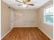 Simple bedroom with wood-look floors and ceiling fan at 2491 Crumps Landing Cir, Snellville, GA 30039