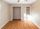 Empty bedroom with wood-look floors and closet at 2491 Crumps Landing Circle, Snellville, GA 30039