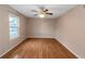 Empty bedroom with wood-look floors and large window at 2491 Crumps Landing Cir, Snellville, GA 30039