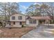 Ranch home with carport and landscaping in the front yard at 2491 Crumps Landing Cir, Snellville, GA 30039