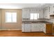 White kitchen features a dishwasher and laminate countertops at 2491 Crumps Landing Circle, Snellville, GA 30039