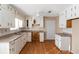 Kitchen with white cabinets and wood floors at 2491 Crumps Landing Cir, Snellville, GA 30039