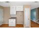 Bright kitchen with white cabinets and laminate countertops at 2491 Crumps Landing Cir, Snellville, GA 30039