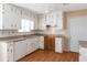 Kitchen with white cabinets and wood floors at 2491 Crumps Landing Circle, Snellville, GA 30039