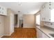 Kitchen with white cabinets and wood floors at 2491 Crumps Landing Cir, Snellville, GA 30039