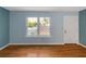 Living room with light blue walls and wood floors at 2491 Crumps Landing Cir, Snellville, GA 30039