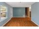 Living area with wood floors, blue walls and stairs at 2491 Crumps Landing Circle, Snellville, GA 30039