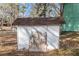 Small, rustic shed with weathered siding at 2491 Crumps Landing Circle, Snellville, GA 30039