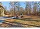 Large backyard with patio and fire pit at 283 Rosebay Ln, Sharpsburg, GA 30277