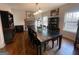 Formal dining room with large table and hardwood floors at 283 Rosebay Ln, Sharpsburg, GA 30277